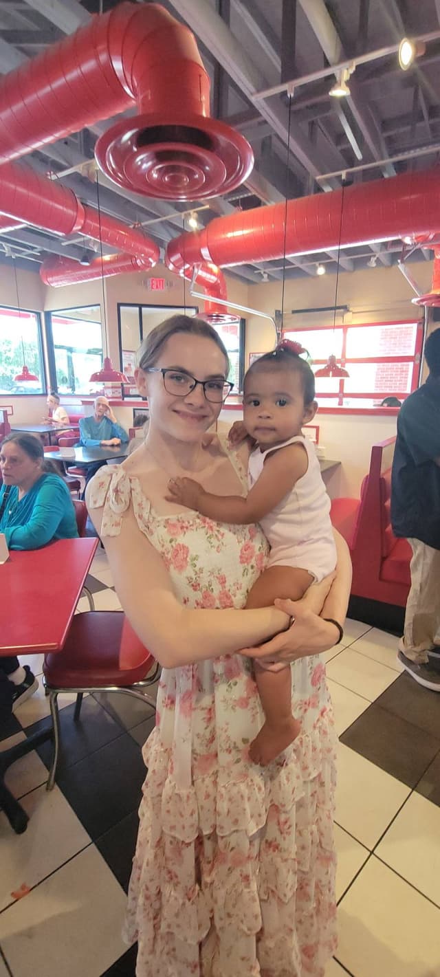 Megan holding a baby
