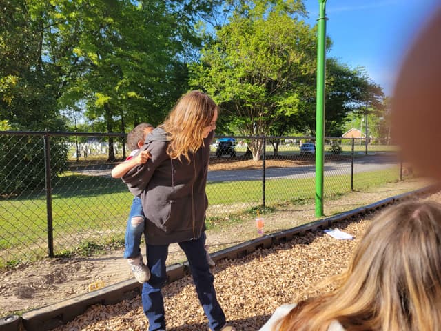 Megan at the playground with a child